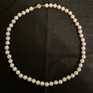 Strand of faux pearls